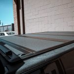 2022 RAM Crew Cab with AMP Research Power Steps and a Bakflip MX4 Tonneau Cover at Dealer Source Ltd in San Antonio, Texas