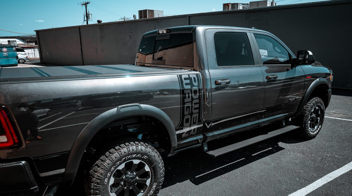 2022 RAM Crew Cab with AMP Research Power Steps and a Bakflip MX4 Tonneau Cover at Dealer Source Ltd in San Antonio, Texas