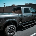 2022 RAM Crew Cab with AMP Research Power Steps and a Bakflip MX4 Tonneau Cover at Dealer Source Ltd in San Antonio, Texas