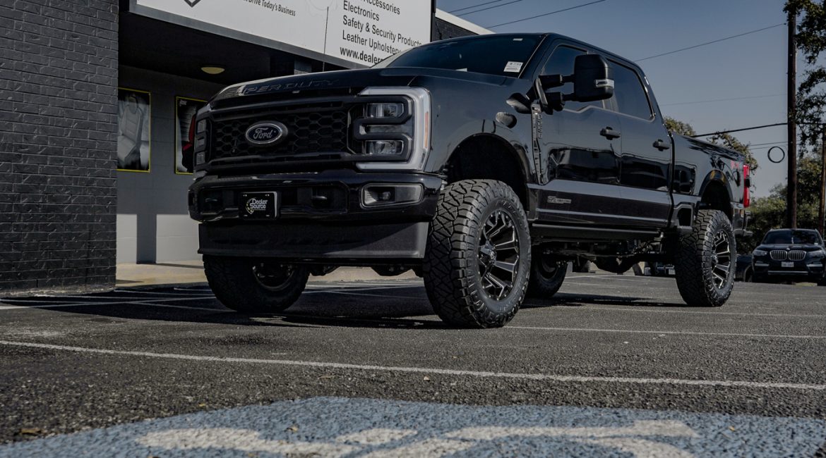 2023 Ford F-250 -Rough Country 3 inch Lift Kit -Wheels- Fuel D576 Assault Size: 20x10 -Tires-Nitto Ridge Grappler -Amp Steps -Black Katzkin Leather with Diamond Lunar Grey inserts, Lunar Grey Wings, & a Lunar Grey Seam