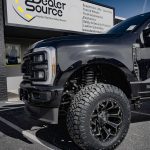2023 Ford F-250 -Rough Country 3 inch Lift Kit -Wheels- Fuel D576 Assault Size: 20x10 -Tires-Nitto Ridge Grappler -Amp Steps -Black Katzkin Leather with Diamond Lunar Grey inserts, Lunar Grey Wings, & a Lunar Grey Seam