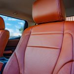 2022 Tundra -Katzkin Leather in the color Cognac. Perforated Combo with Outlaw Suede Wings and a Pearl Seam Reference 99407