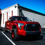 2022 Tundra -Katzkin Leather in the color Cognac. Perforated Combo with Outlaw Suede Wings and a Pearl Seam Reference 99407