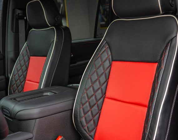 2024 Suburban -Black leather with Red Inserts, TekStitch on Wings with Red Stitching/Pearl Contrast, and Pearl Piping Reference 99704